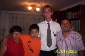 Photo of Elder Willoughby with the family that helped him celebrate his birthday