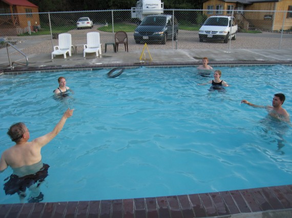 Playing monkey-in-the-middle with a Frisbee in the pool