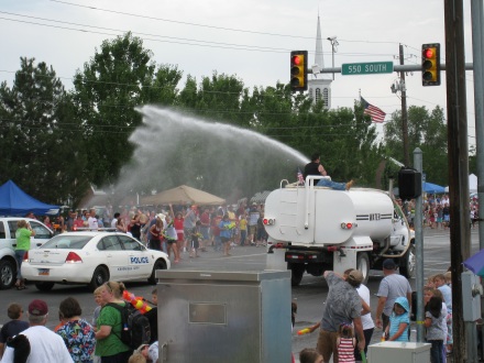 Water trucks hose off pedestrians from city streets