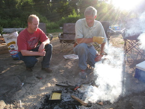 Brett and Bishop Mike Facer cook a meal