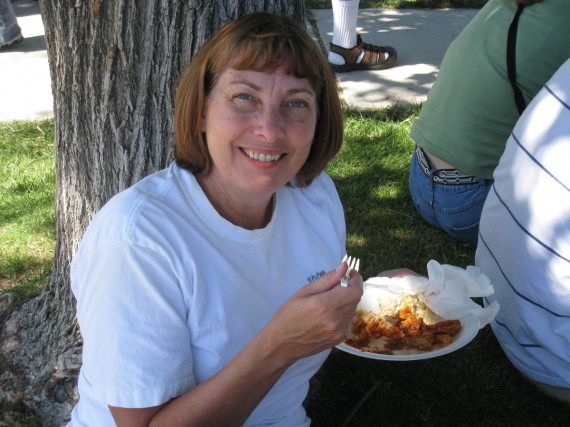 Jill enjoys her food in the shade