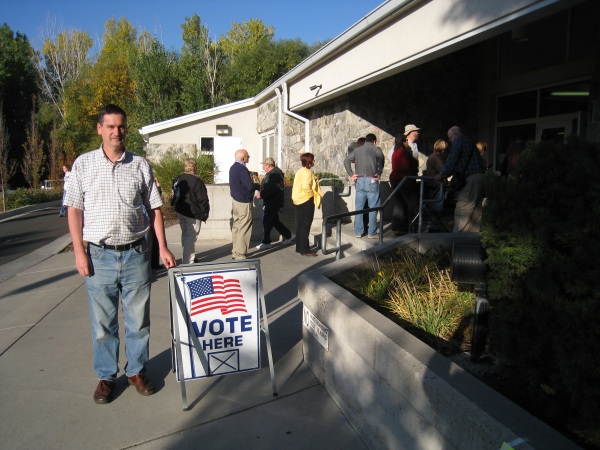 Standing by an early voting line outside the Layton Library.