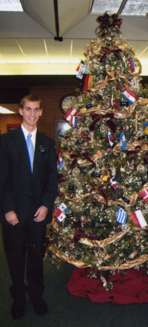 Daniel by the MTC Christmas tree.