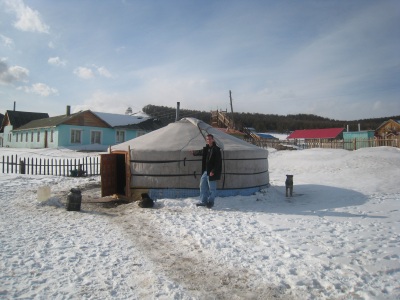 Daniel standing by a ger in Mongolia