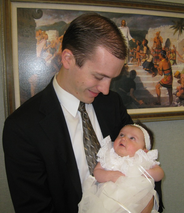 Steven holding Aurora in the church foyer before the blessing