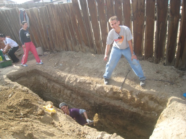 The hole that Daniel helped dig for a part-member family