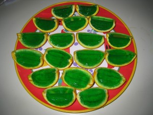 Green Jell-O filled orange wedges