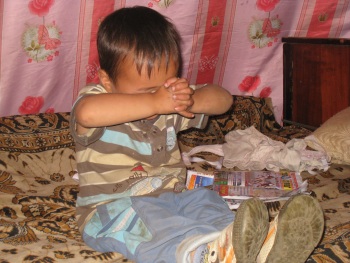 Mongolian child praying.
