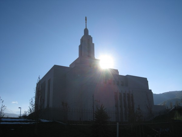 The morning sun shines down on the temple spire