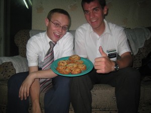 Elder Wright (left) and Daniel with celebratory cookies. 