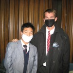 Munkh baatar and Daniel Munkh baatar and Daniel (right) wearing masks to church because of swine flu.
