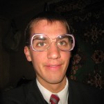 Daniel wearing someone else's glasses.