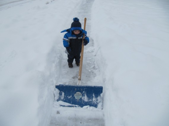 Bryson shoveling snow