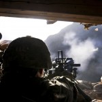 Soldier firing automatic grenade launcher