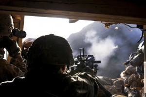 Soldier firing automatic grenade launcher