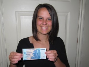 Rachel holding Zimbabwe banknote