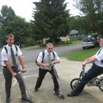 Riding scooters. Daniel on left. Riding scooters. Daniel on left.