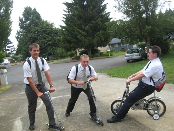 Riding scooters. Daniel on left.