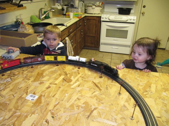 Bryson and Aurura admire the train set