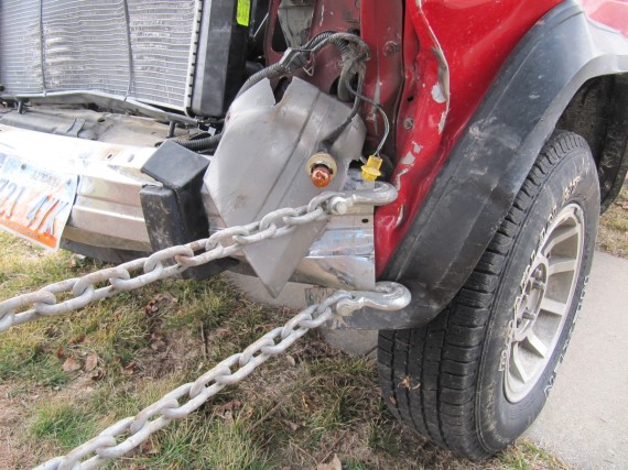 A chain is attached to the Jeep bumper