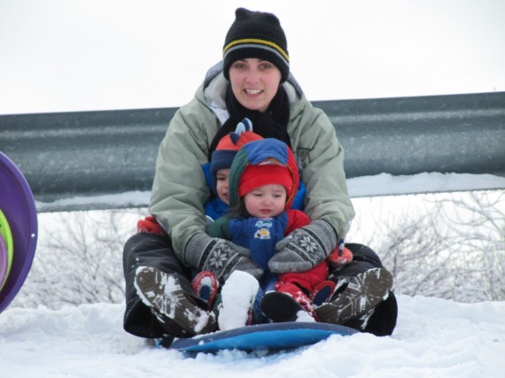 Sarah, Bryson, and Aurora ready to sled